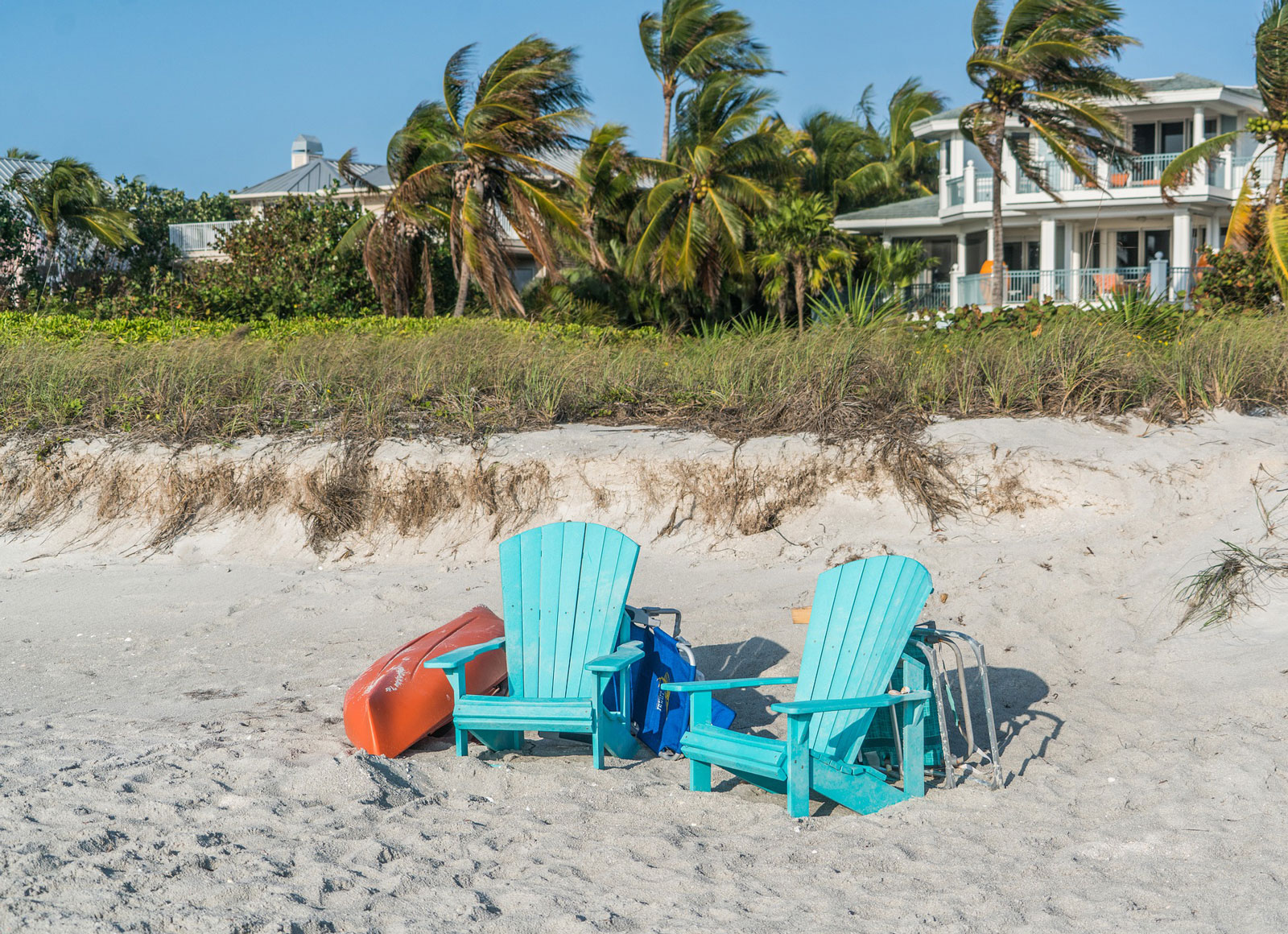 two beach chairs in the sand